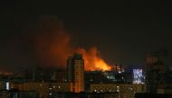 Smoke and flames rise over during the shelling near Kyiv, as Russia continues its invasion of Ukraine February 26, 2022. REUTERS/Gleb Garanich