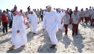 Minister of Environment and Climate Change H E Sheikh Dr. Faleh bin Nasser bin Ahmed bin Ali Al Thani participating in a tree plantation drive at Sealine Reserve yesterday. 