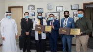 Dr. Muna Al Maslamani, HMC Medical Director of the Communicable Diseases Centre (CDC),  Shaijan M O,  Regional Director of Lulu Group in Qatar, and Krishna Prasad, Marketing Executive at Al Khor Mall, with other officials from HMC and Lulu during the honouring ceremony.
