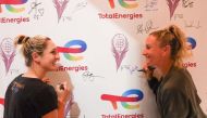 Doubles Players Gabriela Dabrowski and Emily Webley Smith engage in interviews and signatures at the TotalEnergies booth. 