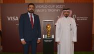 Officials of QNB and Visa with FIFA World Cup Winner’s Trophy during the event.
