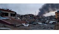 Smoke rises amid damaged buildings following an attack on the Yavoriv military base, as Russia's invasion of Ukraine continues, in Yavoriv, Lviv Oblast, Ukraine, March 13, 2022 in this picture obtained from social media. @BackAndAlive/via REUTERS
