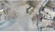 An aeriel view shows an armoured military vehicle next to a building, as Russia's invasion of Ukraine continues, in Mariupol, Ukraine as uploaded on March 13, 2022, in this handout drone video obtained by Reuters on March 13, 2022. Azov Mariupol/Handout via Reuters