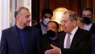 Russian Foreign Minister Sergei Lavrov and Iranian Foreign Minister Hossein Amir-Abdollahian enter a hall during a meeting in Moscow, Russia March 15, 2022. REUTERS/Maxim Shemetov/Pool