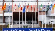 Flags wave outside the Council of Europe building on the day Ukrainian President Volodymyr Zelenskiy addresses the Parliamentary Assembly, in an extraordinary session to discuss Russia's invasion of Ukraine, via videolink in Strasbourg, France March 14, 2022. REUTERS/Arnd Wiegmann
