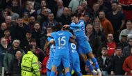 Atletico Madrid’s Renan Lodi celebrates with team-mates after scoring against Manchester United.