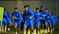Al Gharafa players in action during a training session, yesterday.