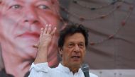 FILE PHOTO: Imran Khan, chairman of the Pakistan Tehreek-e-Insaf (PTI), gestures while addressing his supporters during a campaign meeting ahead of general elections in Karachi, Pakistan, July 4, 2018. REUTERS/Akhtar Soomro/File Photo
