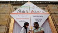 A man receives a dose of vaccine against the coronavirus disease (COVID-19) in front of a giant kite, installed to mark administering 1.45 billion coronavirus disease (COVID-19) vaccine doses in India, Ahmedabad, India, January 6, 2022. REUTERS/Amit Dave

