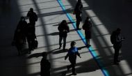 People wearing masks to prevent contracting the coronavirus disease (COVID-19) walk at a railway station in Seoul. Reuters photo