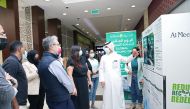Al Meera officials during an activity to mark Global Recycling Day at a store.