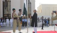 Ambassador Syed Ahsan Raza Shah hoisting the national flag to mark Pakistan Day, at Pakistan Embassy, Doha, yesterday.  