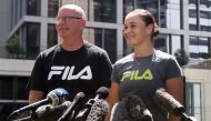 Tennis player Ashleigh Barty and coach Craig Tyzzer speak to the media at a news conference after Barty announced her retirement, at the Westin in Brisbane, Australia, March 24, 2022. AAP Image/Jono Searle via REUTERS