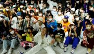 Japanese dancer ReiNa take photos with her students after her dance class in Tokyo, Japan February 26, 2022. Picture taken on February 26, 2022. REUTERS/Kim Kyung-Hoon