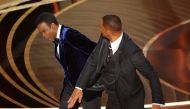 File photo: Will Smith (R) hits Chris Rock as Rock spoke on stage during the 94th Academy Awards in Hollywood, Los Angeles, California, U.S., March 27, 2022. Reuters/Brian Snyder/File Photo

