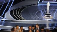 Philippe Rousselet, Fabrice Gianfermi and Patrick Wachsberger win the Oscar for Best Picture for 