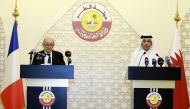 Deputy Prime Minister and Minister of Foreign Affairs H E Sheikh Mohammed bin Abdulrahman Al Thani with his French counterpart Jean-Yves Le Drian during a joint press conference, yesterday.  PIC: RAJAN VADAKKEMURIYIL