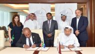 Members of QBA and South African Chamber of Commerce & Industry during the agreement signing ceremony.