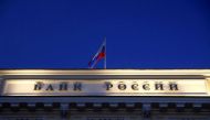 A Russian state flag flies over the Central Bank headquarters in Moscow, Russia March 29, 2021. REUTERS/Maxim Shemetov

