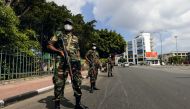 Sri lankan army soldiers stand guard at a checkpoint after the government imposed a curfew following a clash between police and protestors near Sri lankan President Gotabaya Rajapaksa's residence during a protest last Thursday, amid the country's economic crisis, in Colombo, Sri lanka April 3, 2022. REUTERS/