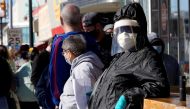 People wait in line to be tested for coronavirus disease (COVID-19) at the Tower Theatre in Oklahoma City, Oklahoma, U.S., January 11, 2022. REUTERS/Nick Oxford

