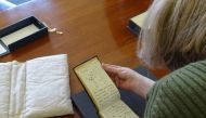 Librarian Jessica Gardner looks at the Tree of Life sketch by British naturalist Charles Darwin from one of his notebooks which have been returned to the library after being reported missing, at the Cambridge University Library in Cambridge, Britain March 14, 2022. Stuart Roberts/Handout via REUTERS