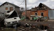  A damaged car and building are seen, amid Russia's invasion of Ukraine, in Kharkiv, April 4, 2022. Reuters/Oleksandr Lapshyn/File Photo