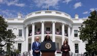 Judge Ketanji Brown Jackson delivers remarks while U.S. President Joe Biden and Vice President Kamala Harris listen as Jackson speaks about her confirmation as the first Black woman to serve on the U.S. Supreme Court, on the South Lawn at the White House in Washington, U.S., April 8, 2022. REUTERS/Kevin Lamarque