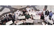 Officials and students during the 8th Gasna Competition for schools organised by the Gas Processing Center (GPC) at the College of Engineering at Qatar University.