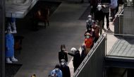 Residents line up for nucleic acid testing at a residential area, during the second stage of a two-stage lockdown to curb the spread of the coronavirus disease (COVID-19), in Shanghai, China April 4, 2022. REUTERS/Aly Song/File Photo