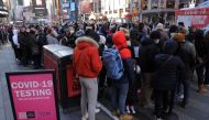 People queue for a COVID-19 test in Times Square as the Omicron coronavirus variant continues to spread in Manhattan, New York City, U.S., December 26, 2021. REUTERS/Andrew Kelly