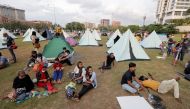 Demonstrators sit in a protest area, dubbed the Gota-Go village, near the Presidential Secretariat, in Colombo, Sri Lanka, April 11, 2022. Reuters/Dinuka Liyanawatte