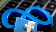 3D-printed images of the logos of Facebook and parent company Meta Platforms are seen on a laptop keyboard in this illustration taken on November 2, 2021. REUTERS/Dado Ruvic

