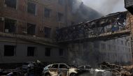 Burned cars are seen outside a destroyed building following Russian shelling, as Russia's attack on Ukraine continues, in Kharkiv, Ukraine, April 16, 2022. (REUTERS/Alkis Konstantinidis)