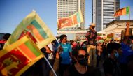 Demonstrators hold Sri Lankan national flags and shout slogans during a protest against Sri Lankan President Gotabaya Rajapaksa, in Colombo, Sri Lanka, April 16, 2022. Reuters/Navesh Chitrakar