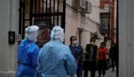 Residents line up for nucleic acid tests during a lockdown, amid the coronavirus disease (COVID-19) pandemic, in Shanghai, China, April 16, 2022. REUTERS/Aly Song/File Photo