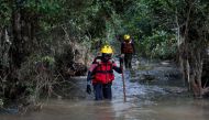Rescuers search for bodies in Umbumbulu near Durban, South Africa, April 18, 2022. REUTERS/Rogan Ward