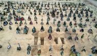 A view of at least three rows of new graves for people killed during Russia's invasion of Ukraine, at a cemetery in Irpin, Kyiv region, Ukraine April 18, 2022. Picture taken with a drone. REUTERS/Zohra Bensemra 