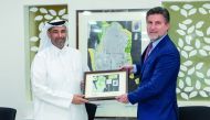 Minister of Environment and Climate Change H E Sheikh Dr. Faleh bin Nasser bin Ahmed bin Ali Al Thani receiving the high-resolution maps of Qatar’s beaches, during his visit to the ExxonMobil Research Qatar (EMRQ) Center at Qatar Science and Technology Park, yesterday.