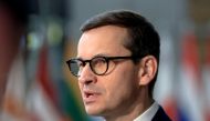 Poland's Prime Minister Mateusz Morawiecki speaks to the media as he arrives for European Union leaders' summit, amid Russia's invasion of Ukraine, in Brussels, Belgium, March 25, 2022. REUTERS/Wolfgang Rattay/File Photo