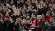 Liverpool fans applaud on the seventh minute for Manchester United 's Cristiano Ronaldo and his family REUTERS/Phil Noble