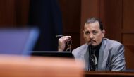 Actor Johnny Depp looks on at the end of the second day of his testimony during the defamation trial against his ex-wife Amber Heard, at the Fairfax County Circuit Courthouse in Fairfax, Virginia, U.S., April 20, 2022. REUTERS/Evelyn Hockstein/Pool