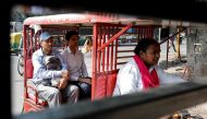 Binota Gayen, 45, rides an electric rickshaw carrying passengers in New Delhi, India, October 5, 2018. REUTERS/Anushree Fadnavis

