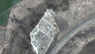 A satellite image shows the expansion of new graves at a cemetery in Vynohradne, near Mariupol, Ukraine, March 29, 2022. Satellite image 2022 Maxar Technologies/Handout via Reuters