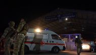 An ambulance drives at the entrance of the port of Tripoli, following the sinking of a boat off the coast of Lebanon's northern port city of Tripoli, in Tripoli, Lebanon April 23, 2022. Reuters/Omar Ibrahim
