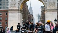 FILE PHOTO: People wearing protective masks are seen in Washington Square park during the outbreak of the coronavirus disease (COVID-19) in the Manhattan borough of New York City, New York, U.S., March 25, 2021. REUTERS/Jeenah Moon/File Photo

