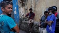 Workers are seen at a closed essential food store during a nationwide strike demanding the resignation of President Goatabaya Takapaksa and his cabinet in Colombo, Sri Lanka, April 28, 2022. Reuters/Dinuka Liyanawatte