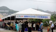 People line up at a testing centre for the coronavirus disease (COVID-19) in Keelung, Taiwan April 28, 2022. REUTERS/I-Hwa Cheng