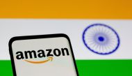 FILE PHOTO: Smartphone with Amazon logo is seen in front of displayed Indian flag in this illustration taken, July 30, 2021. REUTERS/Dado Ruvic/File Photo
