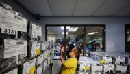 A teacher verifies ballots at the Makati City Hall ahead of the 2022 national elections in Metro Manila, Philippines, May 6, 2022. REUTERS/Willy Kurniawan